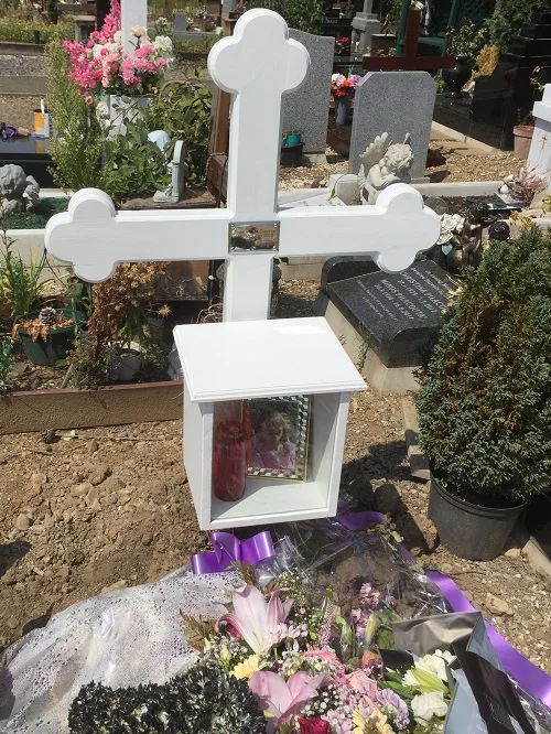 White temporary cross and box