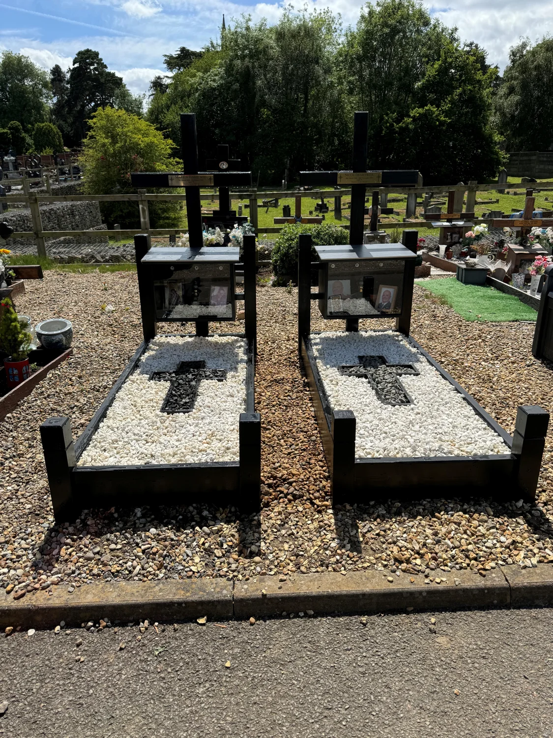 Two dark oak Sandringham memorials with polar white stones